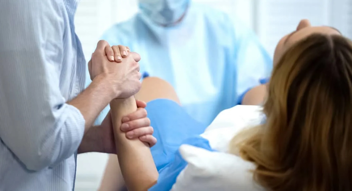 Holding hands at birth